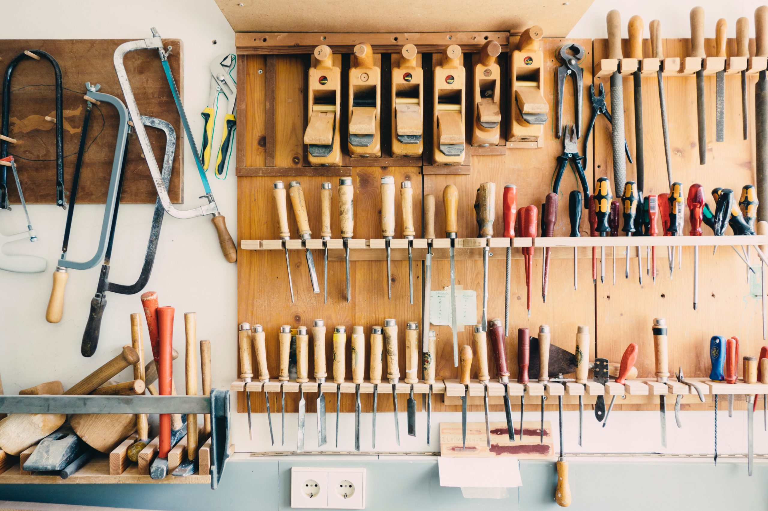 hardware tools organized on a typical garage wall as a metaphor for social media tools