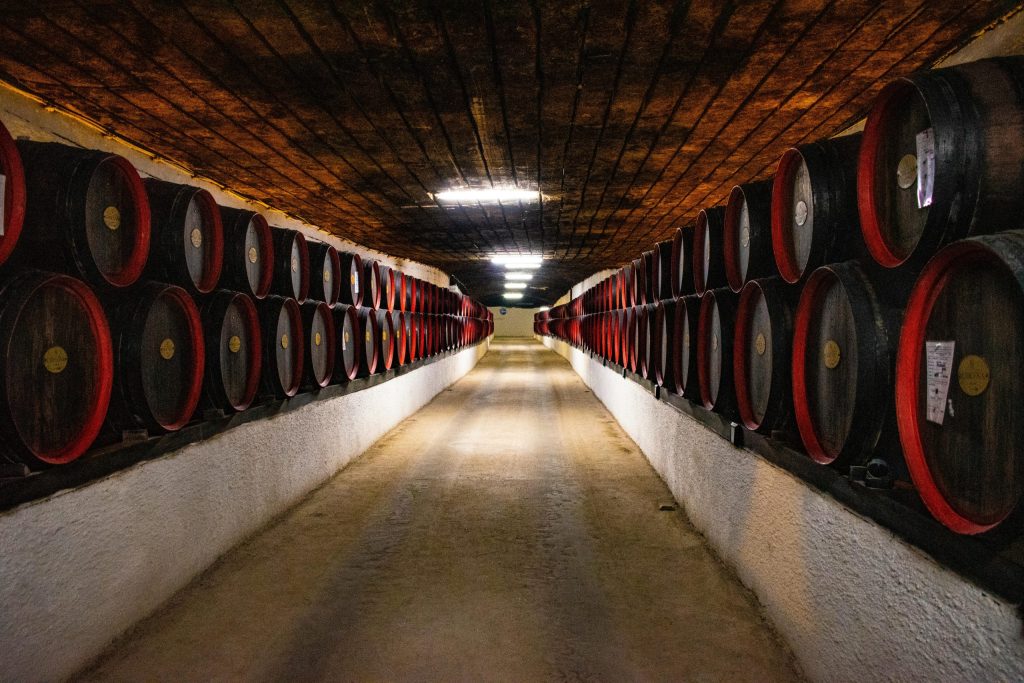 Barrels Stored in a Winery in Willamette Valley. A MiscGyan client. Image has been used in a MiscGyan Blog explaining wine marketing strategies.