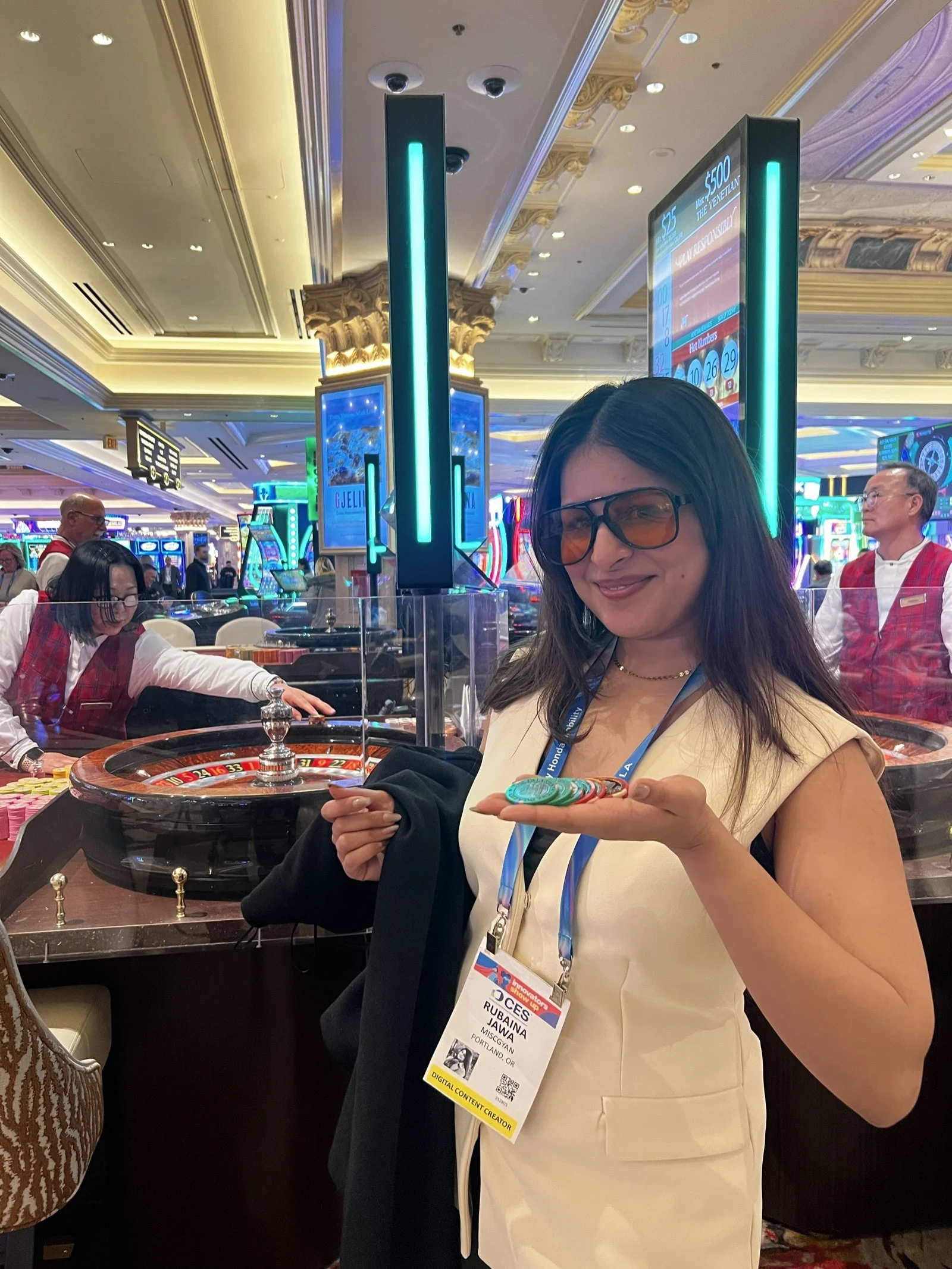 Rubaina at a conference with neon lights